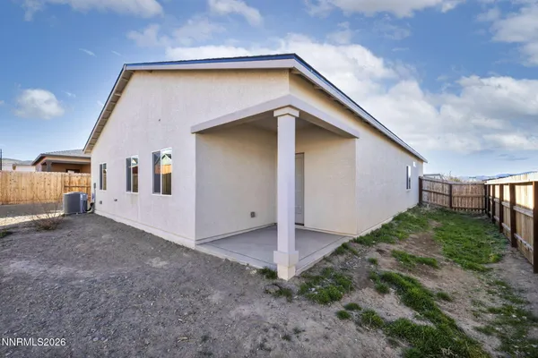 a view of a porch with wooden floor and a floor to ceiling window