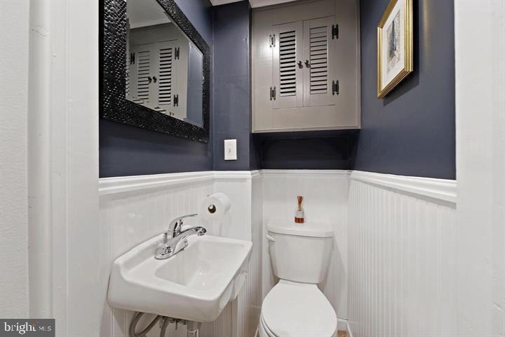 3528 Beech Avenue Baltimore, MD 21211 - Photo 16 of 19 a bathroom with a sink and a toilet