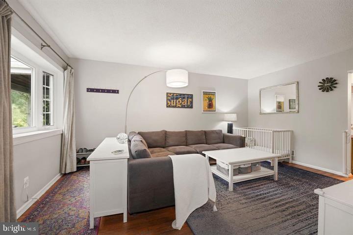 3528 Beech Avenue Baltimore, MD 21211 - Photo 3 of 19 a living room with furniture and a window