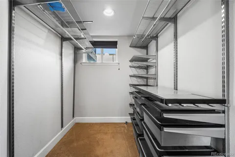 a view of storage and utility room with racks on the wall