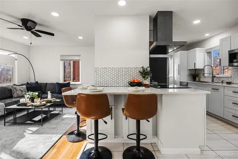 a kitchen with stainless steel appliances granite countertop a sink and cabinets