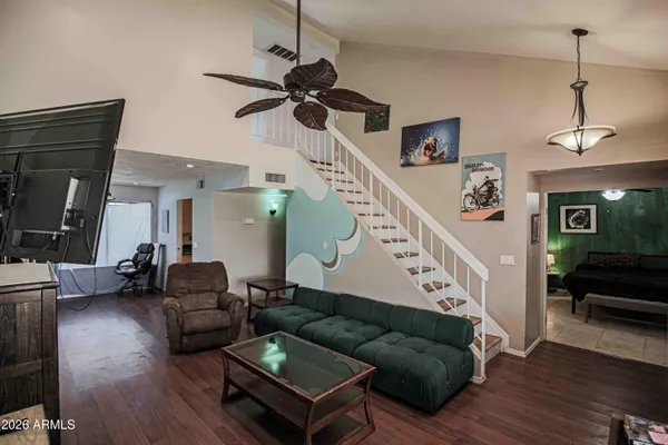a living room with furniture and a flat screen tv