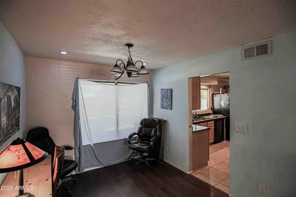 a bedroom with a bed and two windows