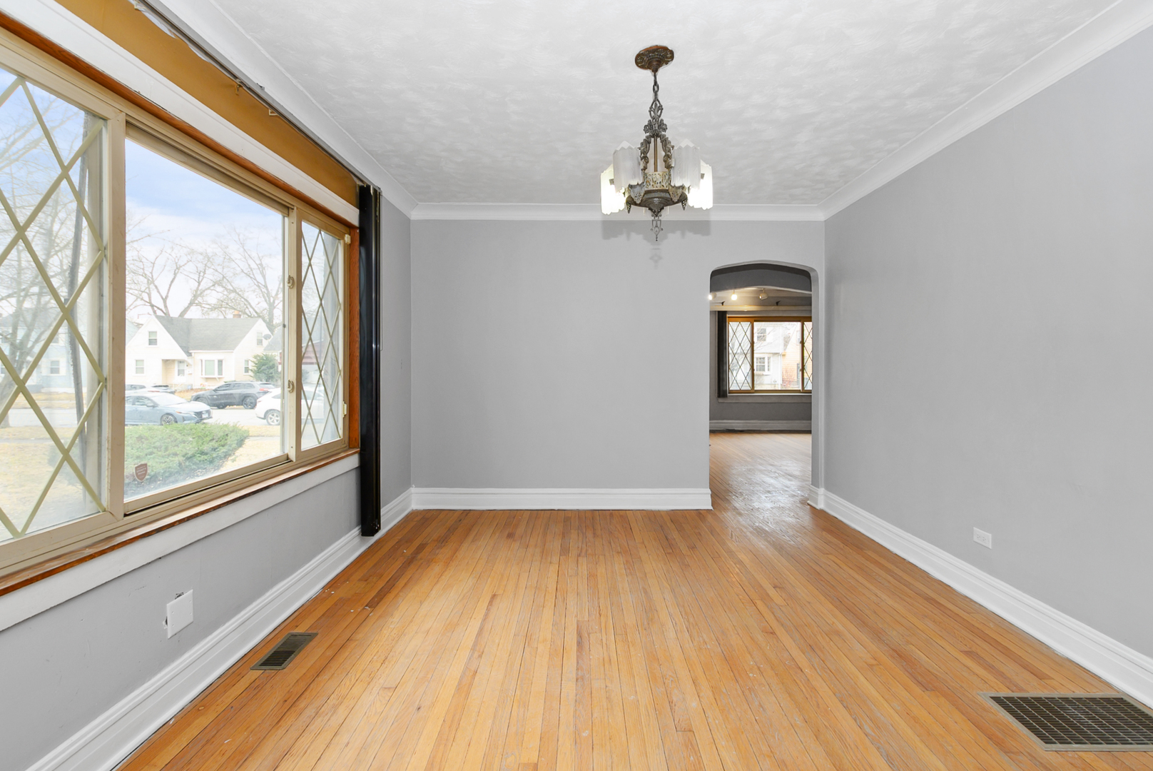 14823 Grant Street Dolton, IL 60419 - Photo 12 of 37 a view of empty room with wooden floor and fan