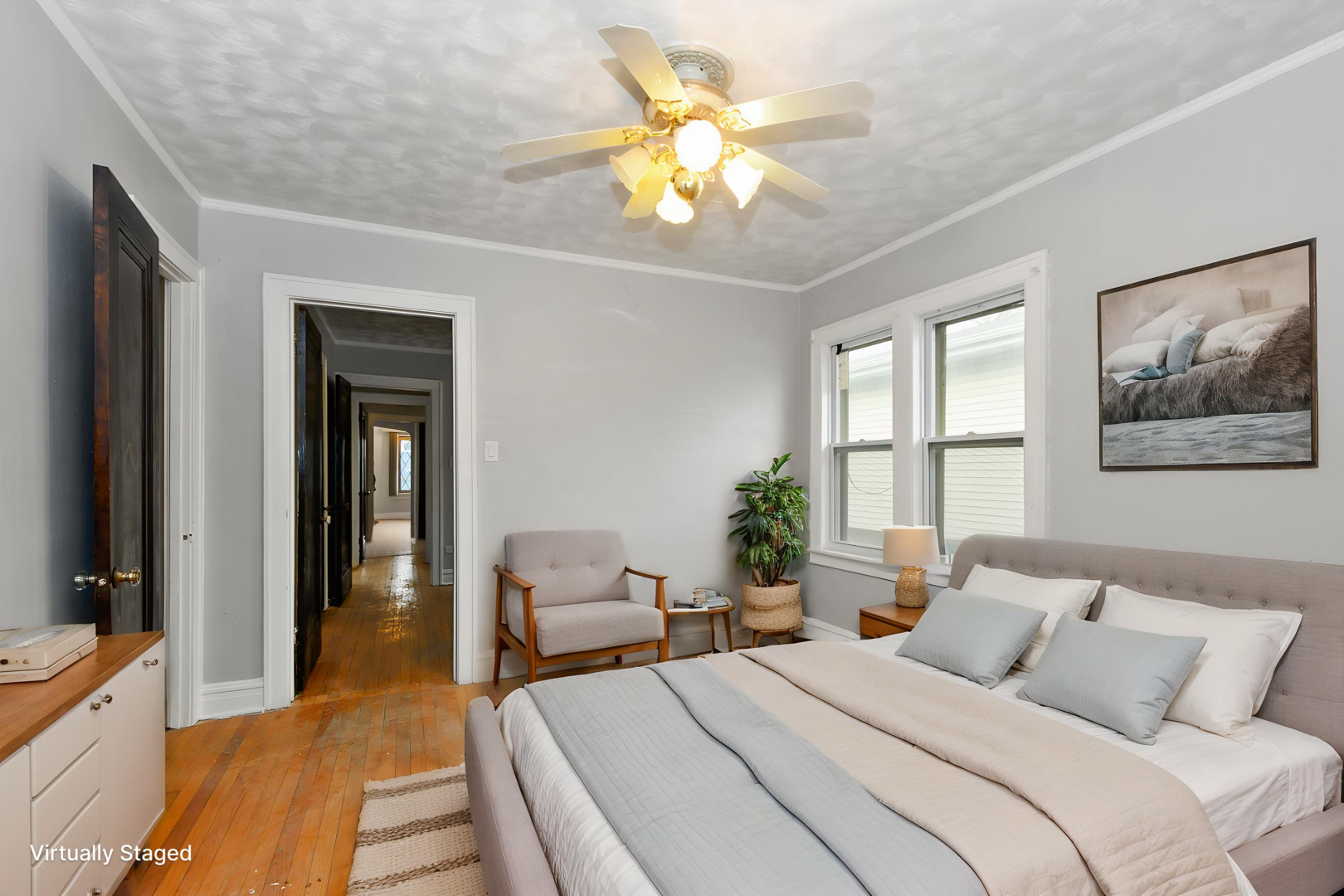 14823 Grant Street Dolton, IL 60419 - Photo 18 of 37 a bedroom with a bed and a chandelier