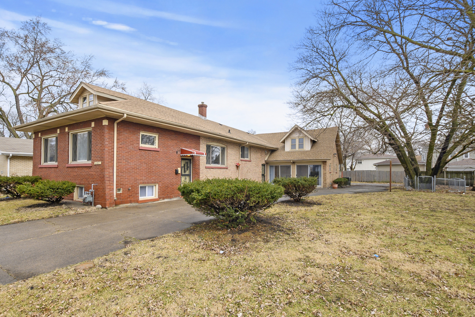 14823 Grant Street Dolton, IL 60419 - Photo 2 of 37 a front view of a house with yard