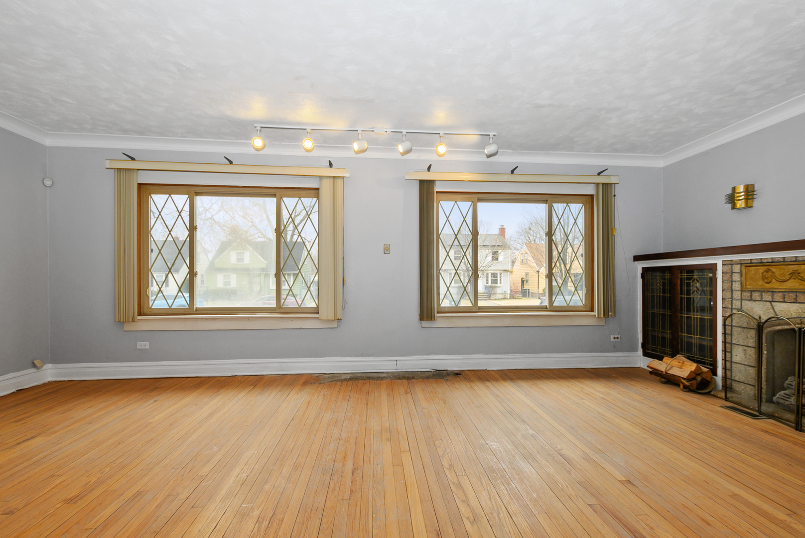14823 Grant Street Dolton, IL 60419 - Photo 9 of 37 an empty room with wooden floor and windows