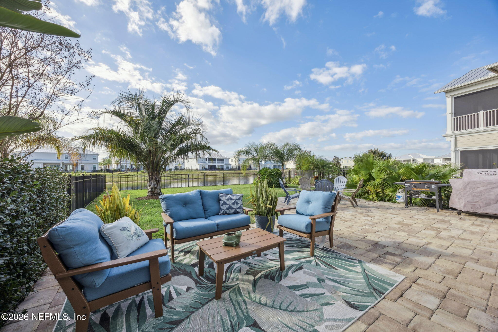 a backyard of a house with outdoor seating