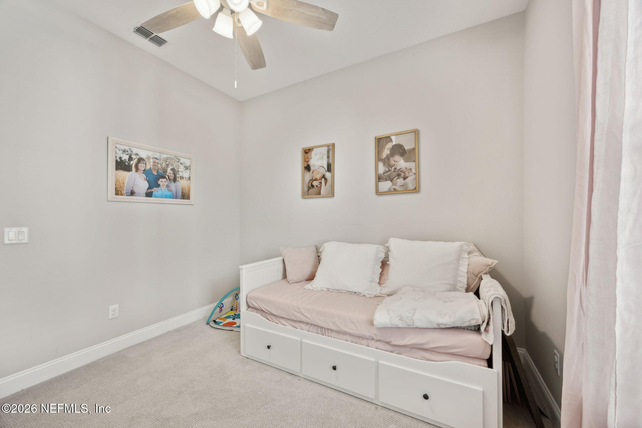 668 Rum Runner Way St. Johns, FL 32259 - Photo 25 of 81 a living room with furniture and a wall painting