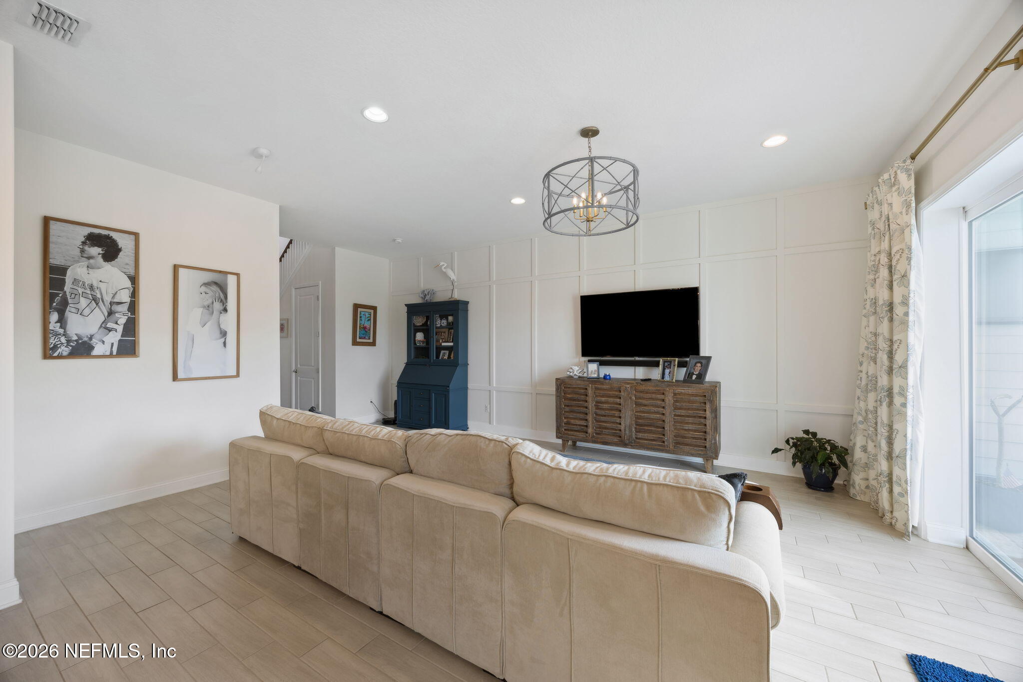 668 Rum Runner Way St. Johns, FL 32259 - Photo 8 of 81 a living room with furniture and a flat screen tv