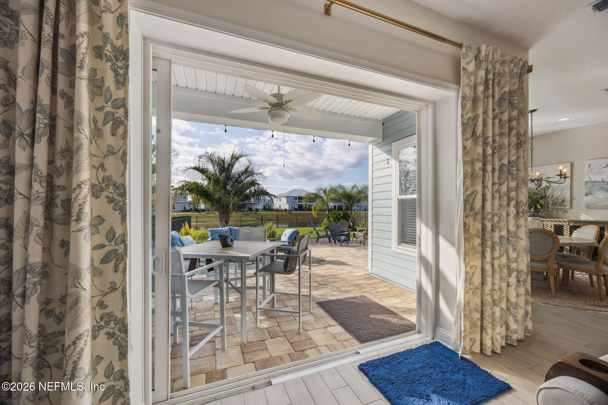 668 Rum Runner Way St. Johns, FL 32259 - Photo 10 of 81 a dining room with furniture a chandelier and wooden floor