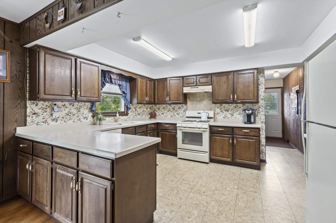 245 Bradwell Road Inverness, IL 60010 - Photo 13 of 43 a kitchen with a sink appliances cabinets and a counter top space