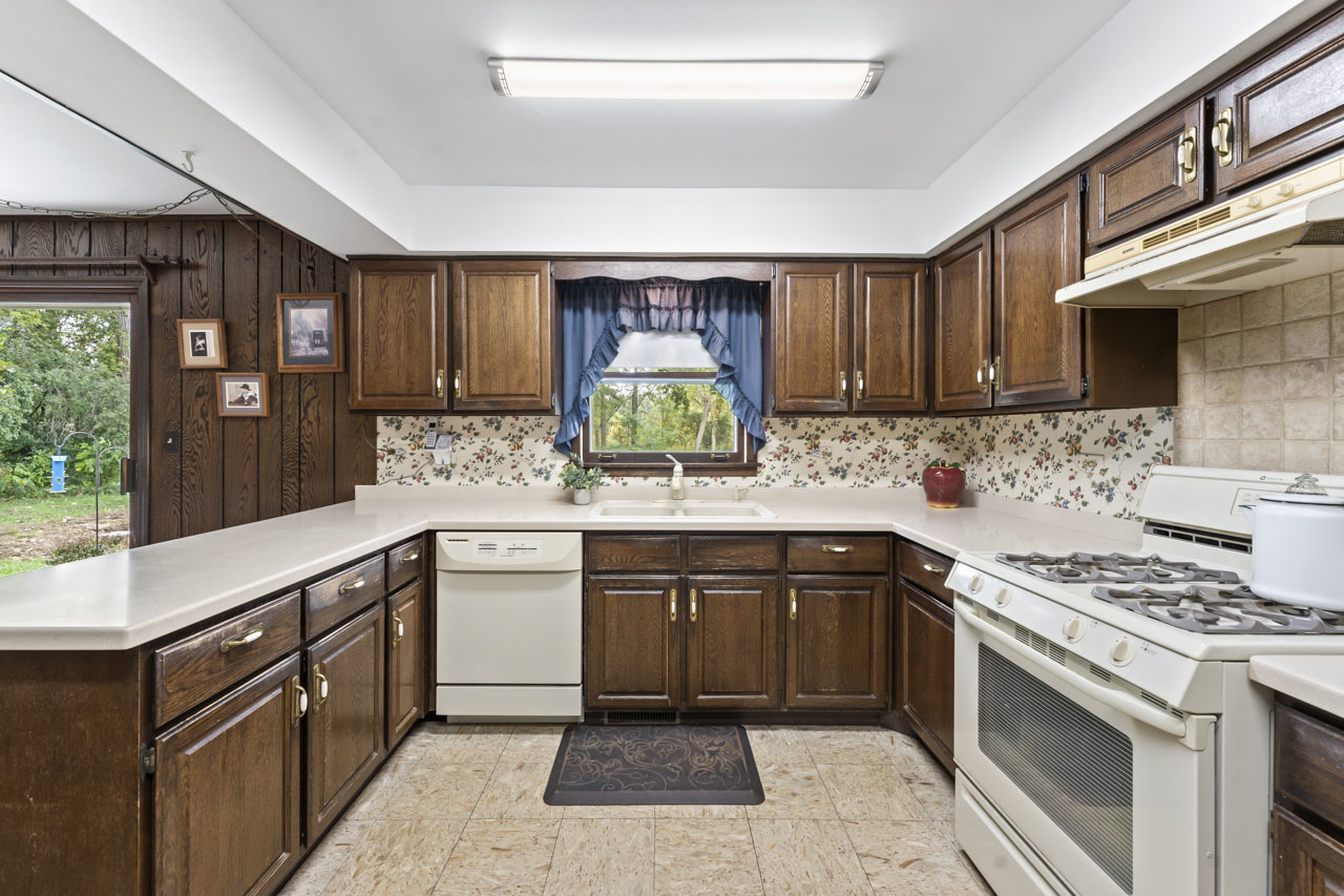 245 Bradwell Road Inverness, IL 60010 - Photo 14 of 43 a kitchen with a sink stove and cabinets