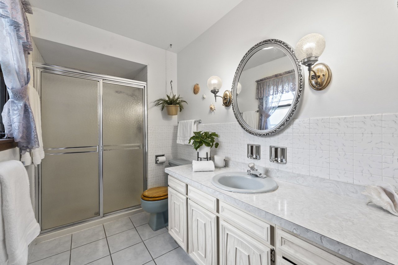 245 Bradwell Road Inverness, IL 60010 - Photo 23 of 43 a bathroom with a toilet sink and mirror