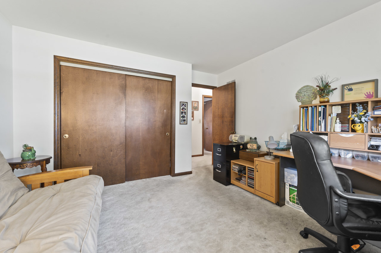 245 Bradwell Road Inverness, IL 60010 - Photo 25 of 43 a bedroom with furniture and a book shelf