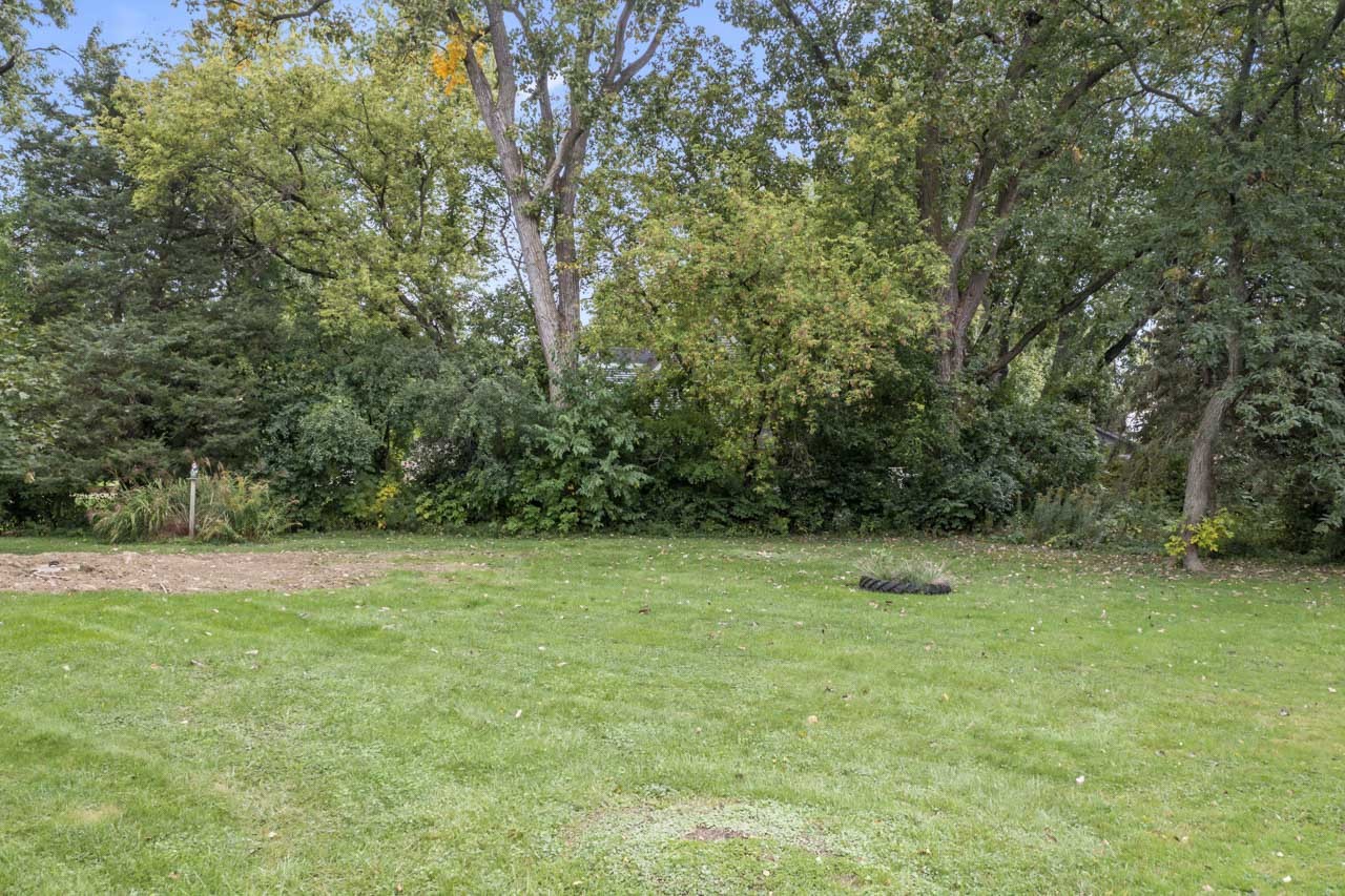 245 Bradwell Road Inverness, IL 60010 - Photo 33 of 43 a view of outdoor space with a field and trees in the background