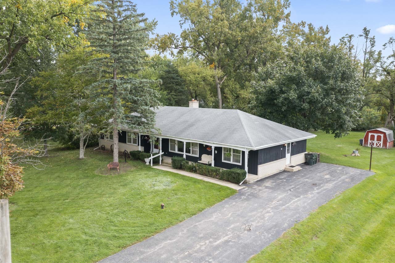 245 Bradwell Road Inverness, IL 60010 - Photo 34 of 43 a aerial view of a house with swimming pool next to a big yard