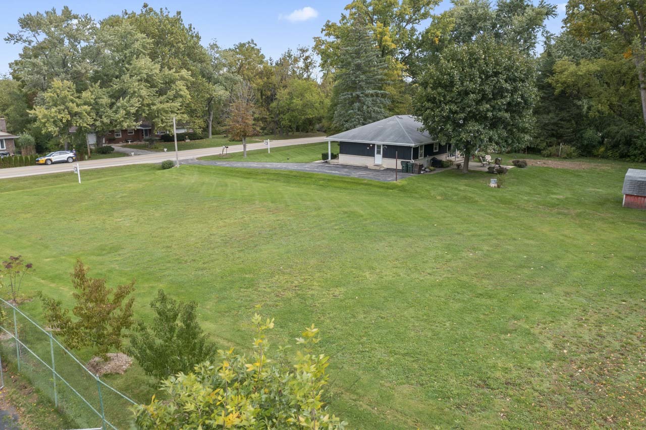 245 Bradwell Road Inverness, IL 60010 - Photo 35 of 43 a view of a house with a yard and sitting area