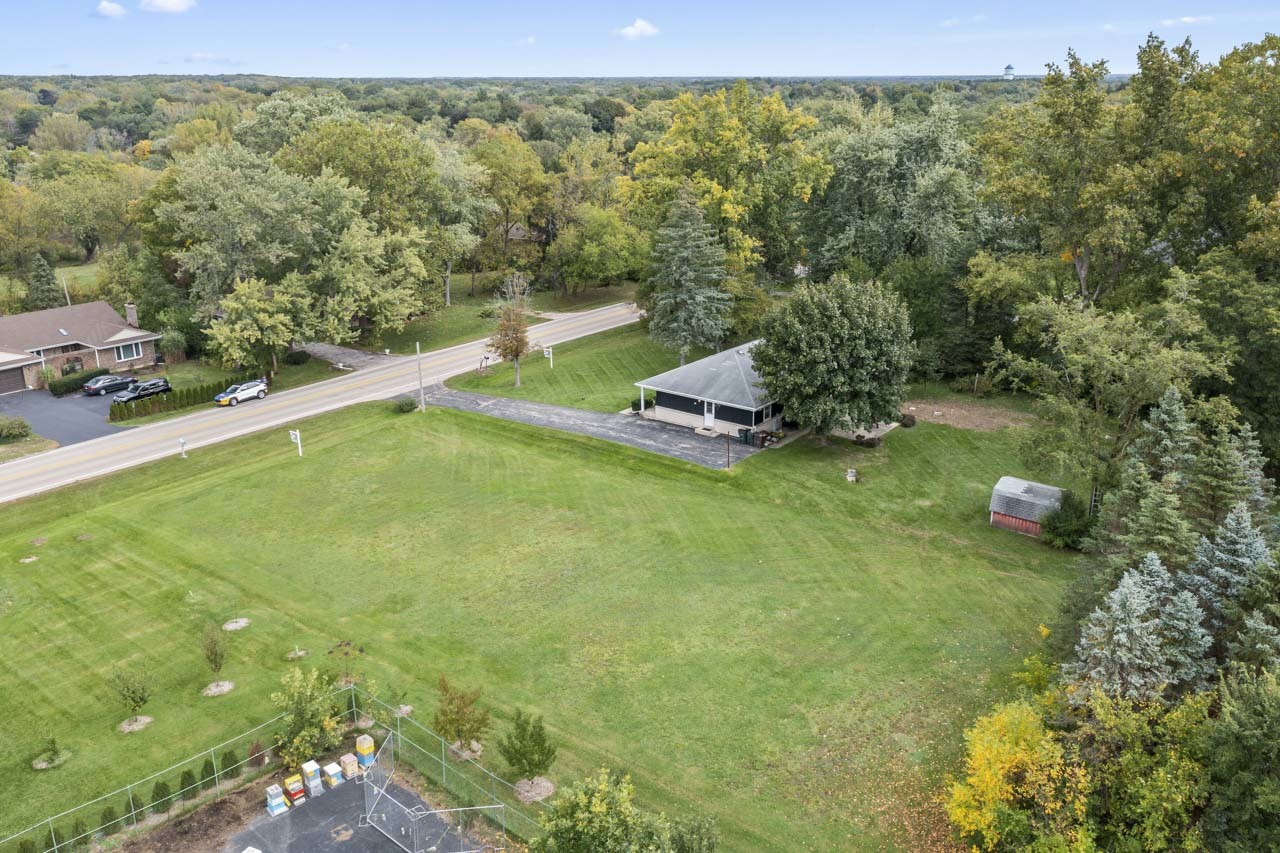 245 Bradwell Road Inverness, IL 60010 - Photo 37 of 43 a view of a green field with trees in the background