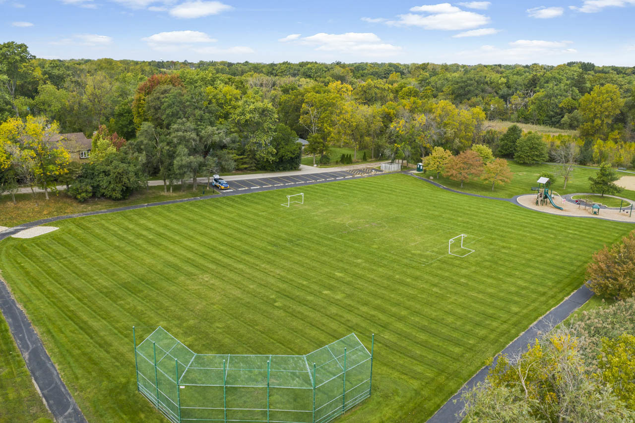 245 Bradwell Road Inverness, IL 60010 - Photo 40 of 43 a view of a golf course with a lake