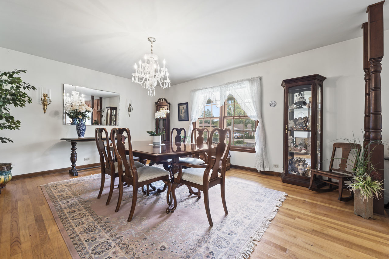 245 Bradwell Road Inverness, IL 60010 - Photo 10 of 43 a view of a dining room with furniture and wooden floor