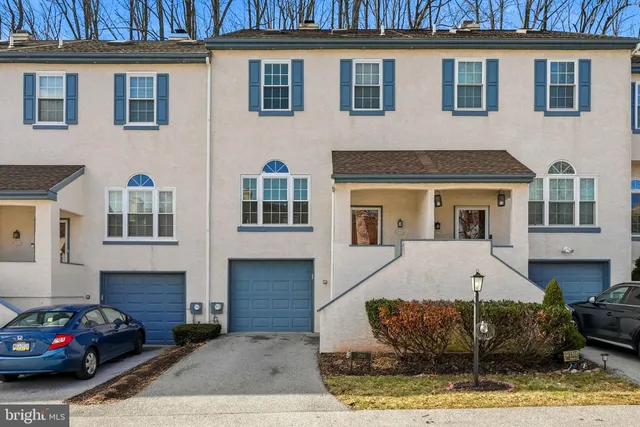 a front view of a house with parking space