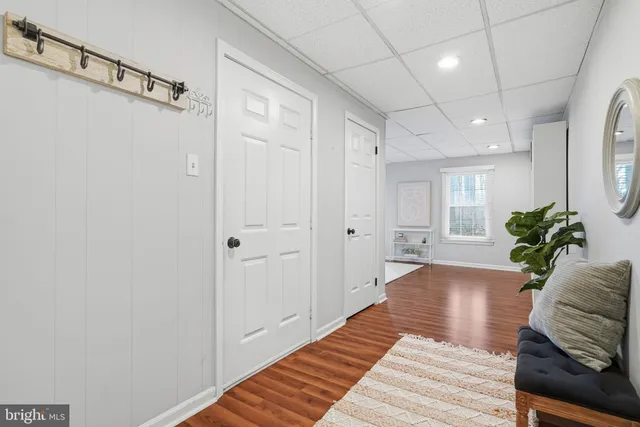 a bathroom with a toilet sink and a mirror