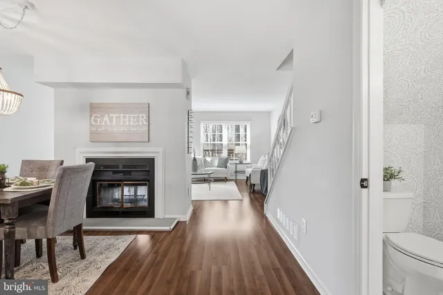 a bathroom with a granite countertop sink and mirror