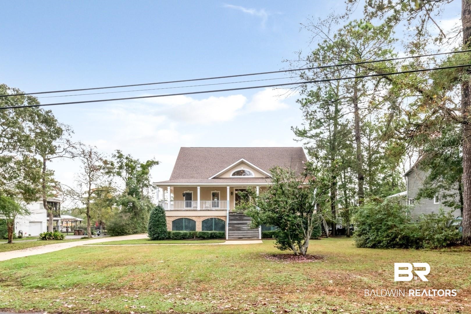 3500 North Riviere Du Chien Loop Mobile, AL 36693 - Photo 66 of 74 View of front of house featuring a front lawn and a porch