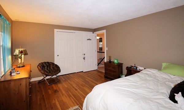 33 Decatur Lane Wayland, MA 01778 - Photo 23 of 24 a bedroom with bed and wooden floor