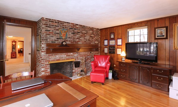 33 Decatur Lane Wayland, MA 01778 - Photo 6 of 24 a living room with furniture and a fireplace