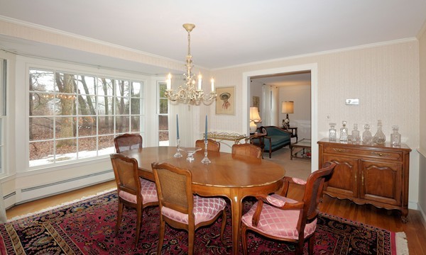 33 Decatur Lane Wayland, MA 01778 - Photo 8 of 24 a dining room with furniture a chandelier and wooden floor