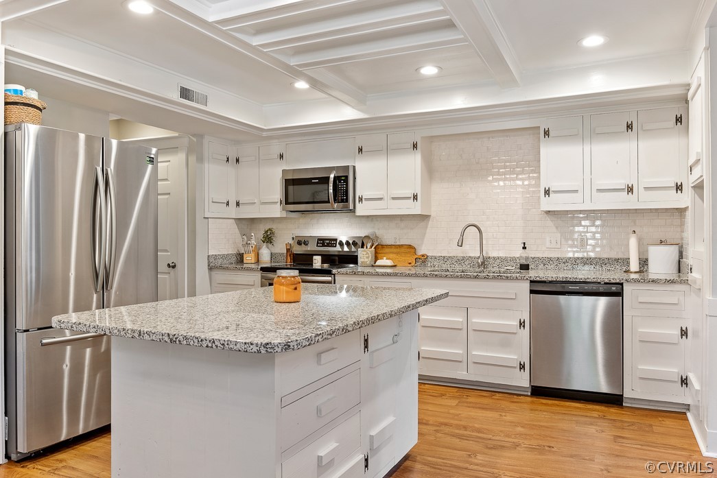 4748 Wedgemere Road Chesterfield, VA 23832 - Photo 12 of 35 a kitchen with stainless steel appliances granite countertop a refrigerator a sink dishwasher a stove top oven a refrigerator with white cabinets and wooden floor