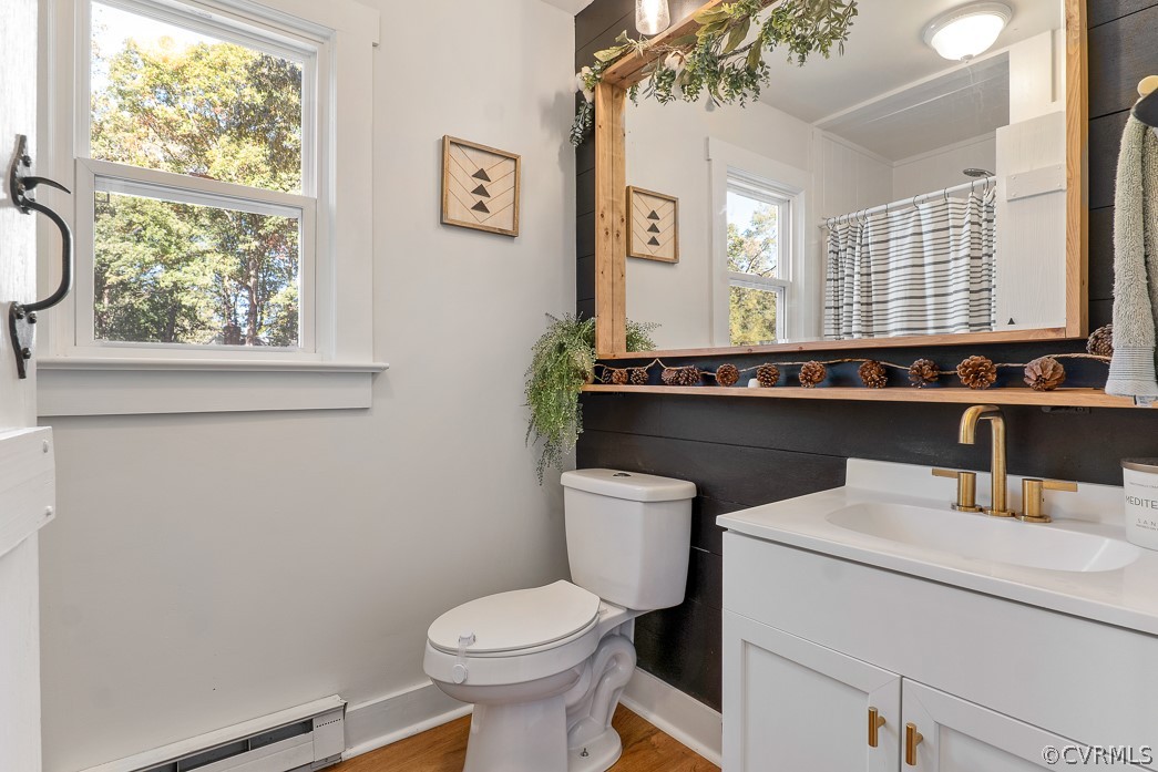 4748 Wedgemere Road Chesterfield, VA 23832 - Photo 16 of 35 a bathroom with a sink a toilet and a window