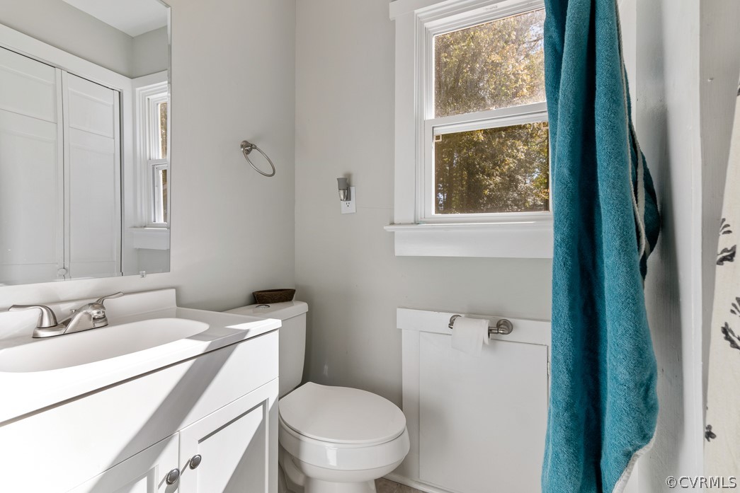 4748 Wedgemere Road Chesterfield, VA 23832 - Photo 22 of 35 a bathroom with a sink a toilet and a window