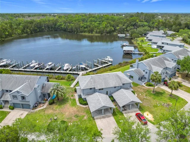 an aerial view of a house with a lake view