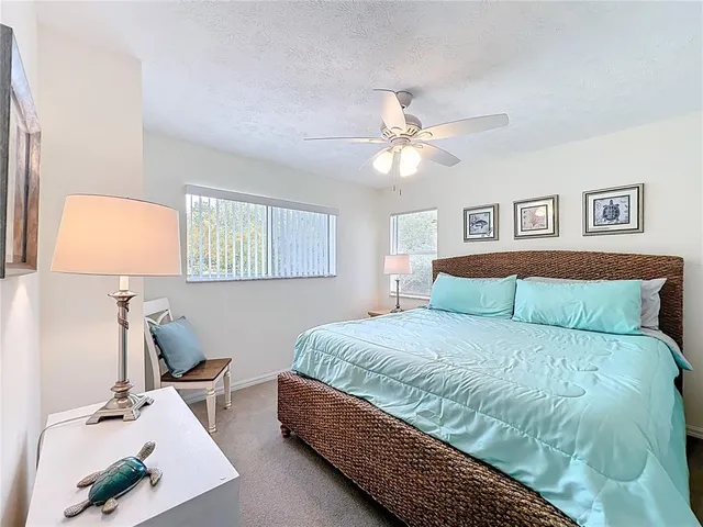 a bedroom with a bed and a lamp