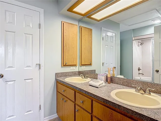 a white toilet sitting next to a bath tub