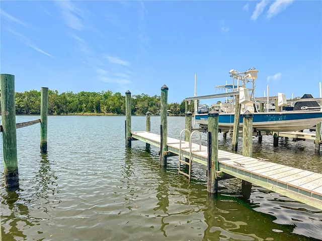 a view of swimming pool with outdoor seating