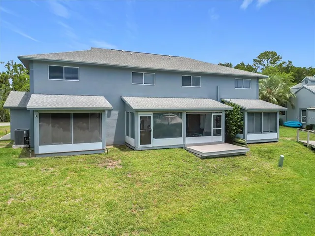 a aerial view of a house with pool