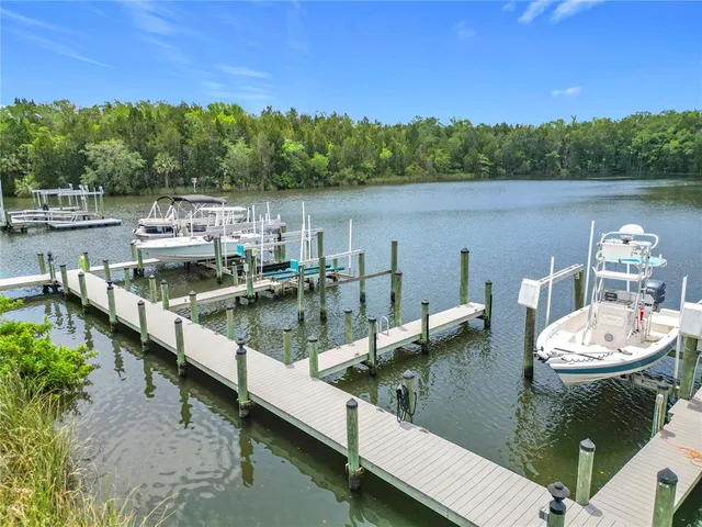 a view of a house with swimming pool and sitting area