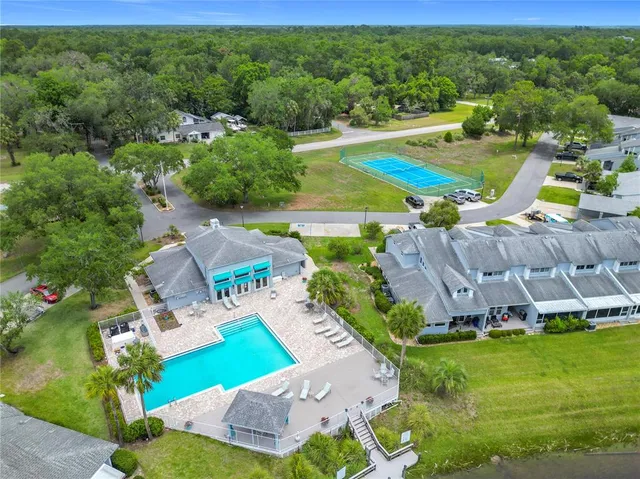 an aerial view of a house with garden space and street view