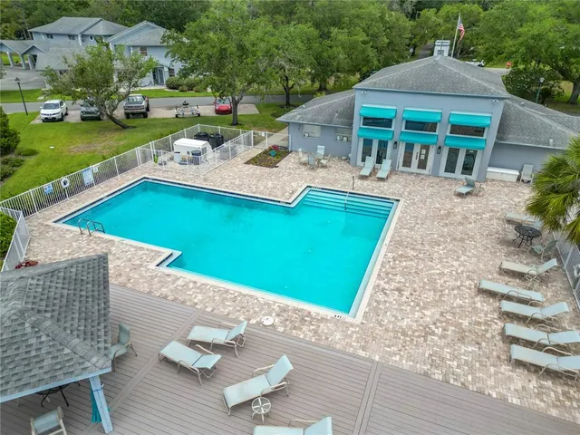 an aerial view of a house with a lake view