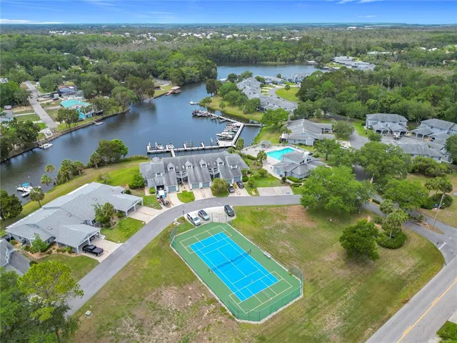 an aerial view of a house with a yard table and chairs