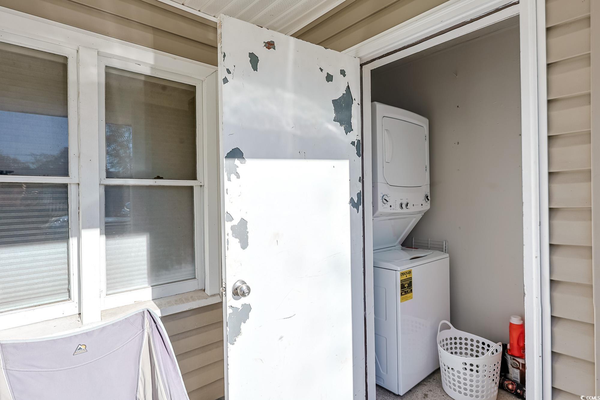 718 Juniper Drive Surfside Beach, SC 29575 - Photo 14 of 18 Laundry area featuring estacked washer and dryer