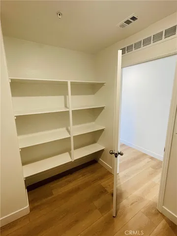 a spacious bathroom with a double vanity sink and a mirror