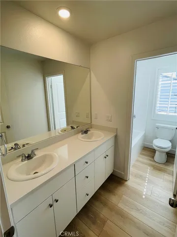 a bathroom with a toilet and a bathtub
