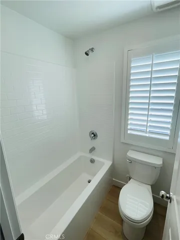 a view of empty room with windows