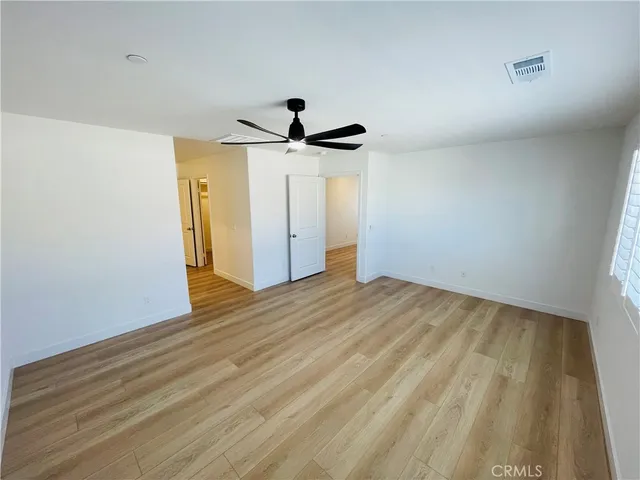 a spacious bathroom with a double vanity sink and a mirror