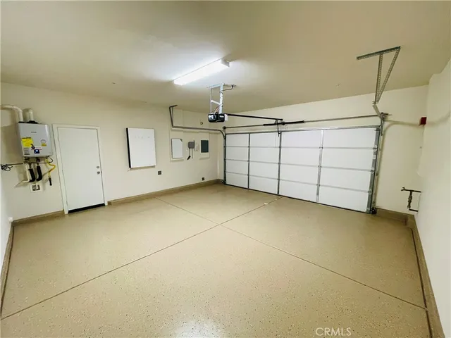 a view of an house with backyard space and balcony